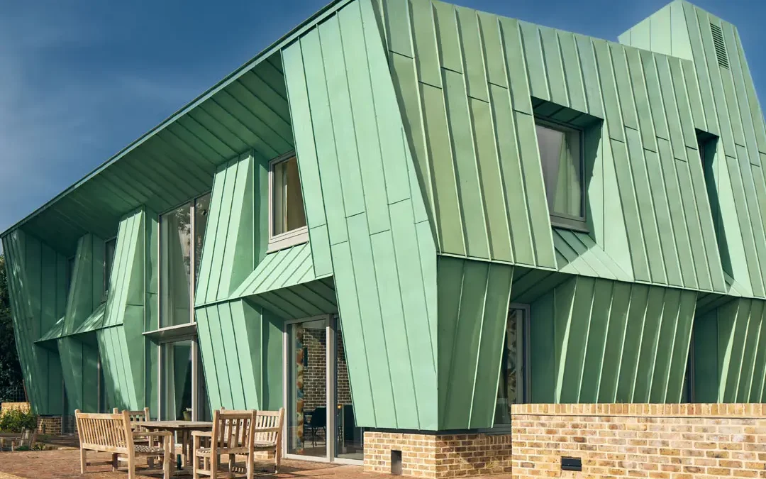 A green, bespoke building.