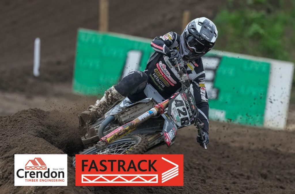 Motorcross rider on muddy track