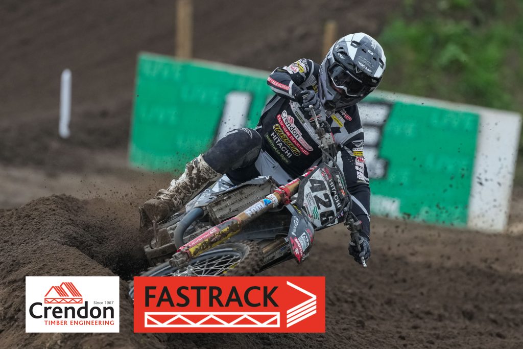 Motorcross rider on muddy track