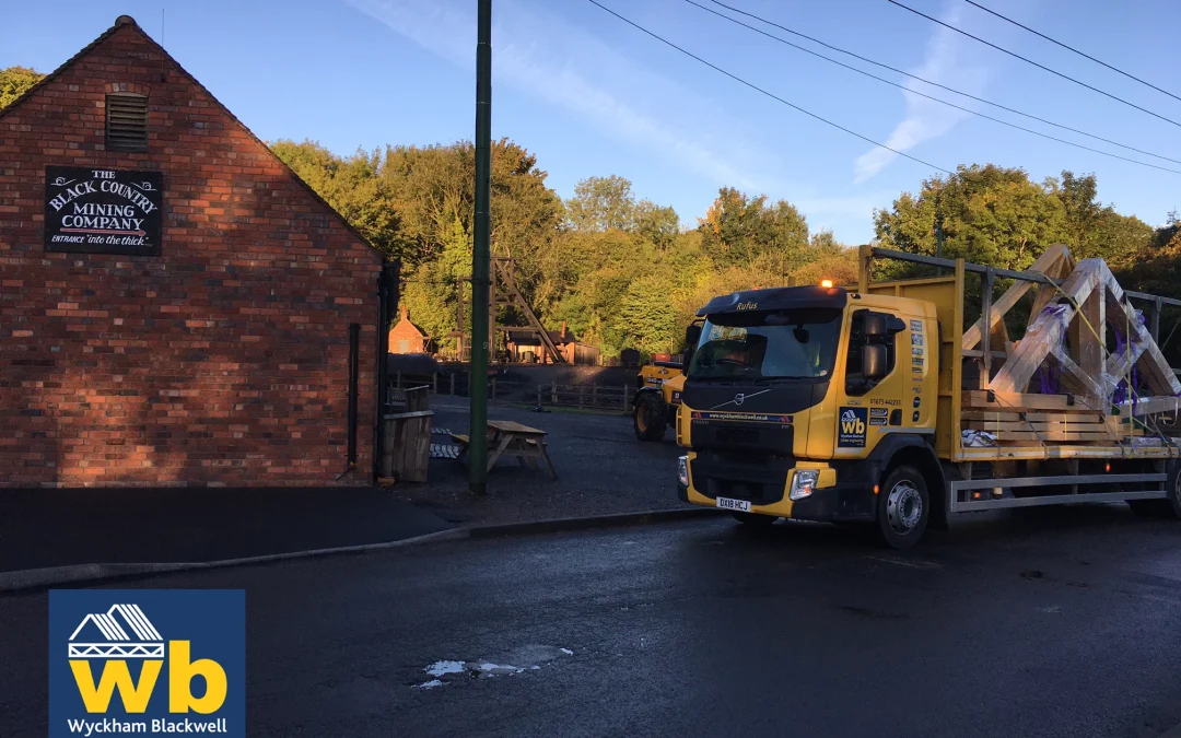 Wyckham Blackwell lorry next to brick building