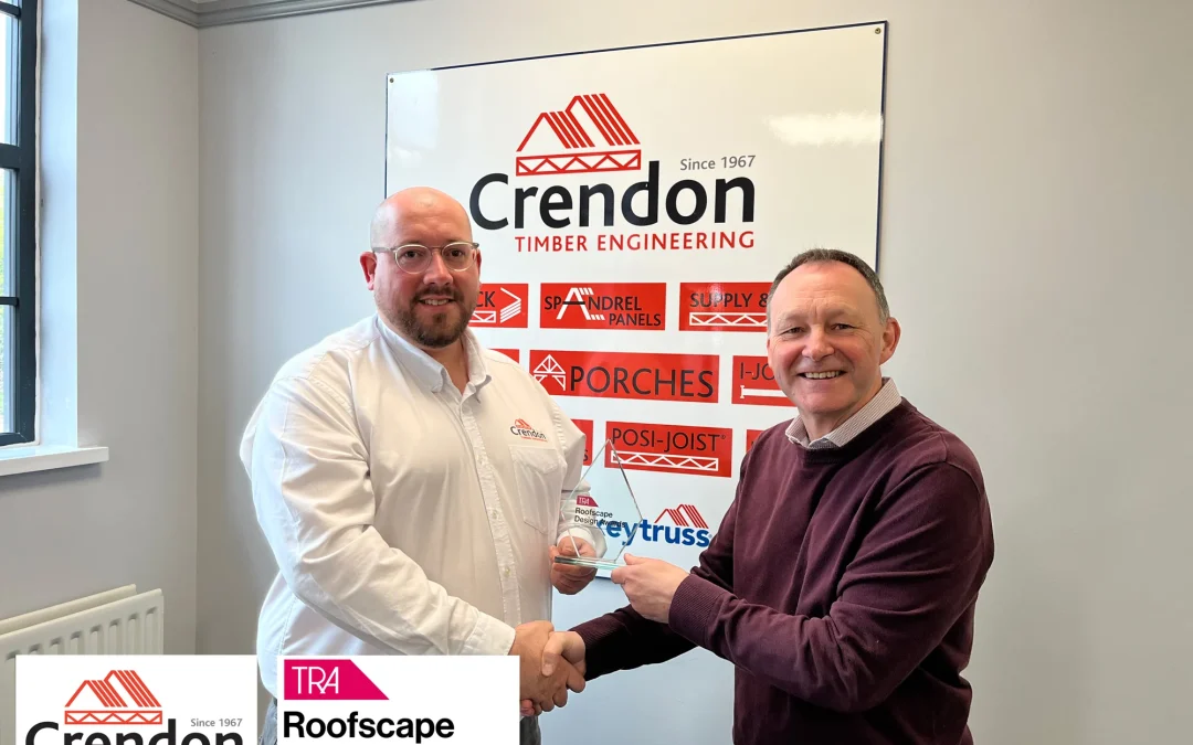 Two men posing with an award