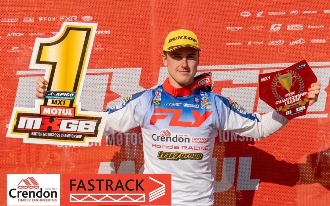 Man with awards after winning a race