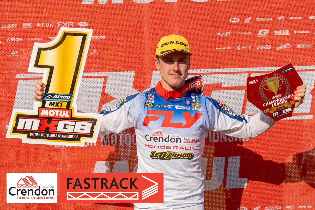 Unknown Man with awards after winning a race