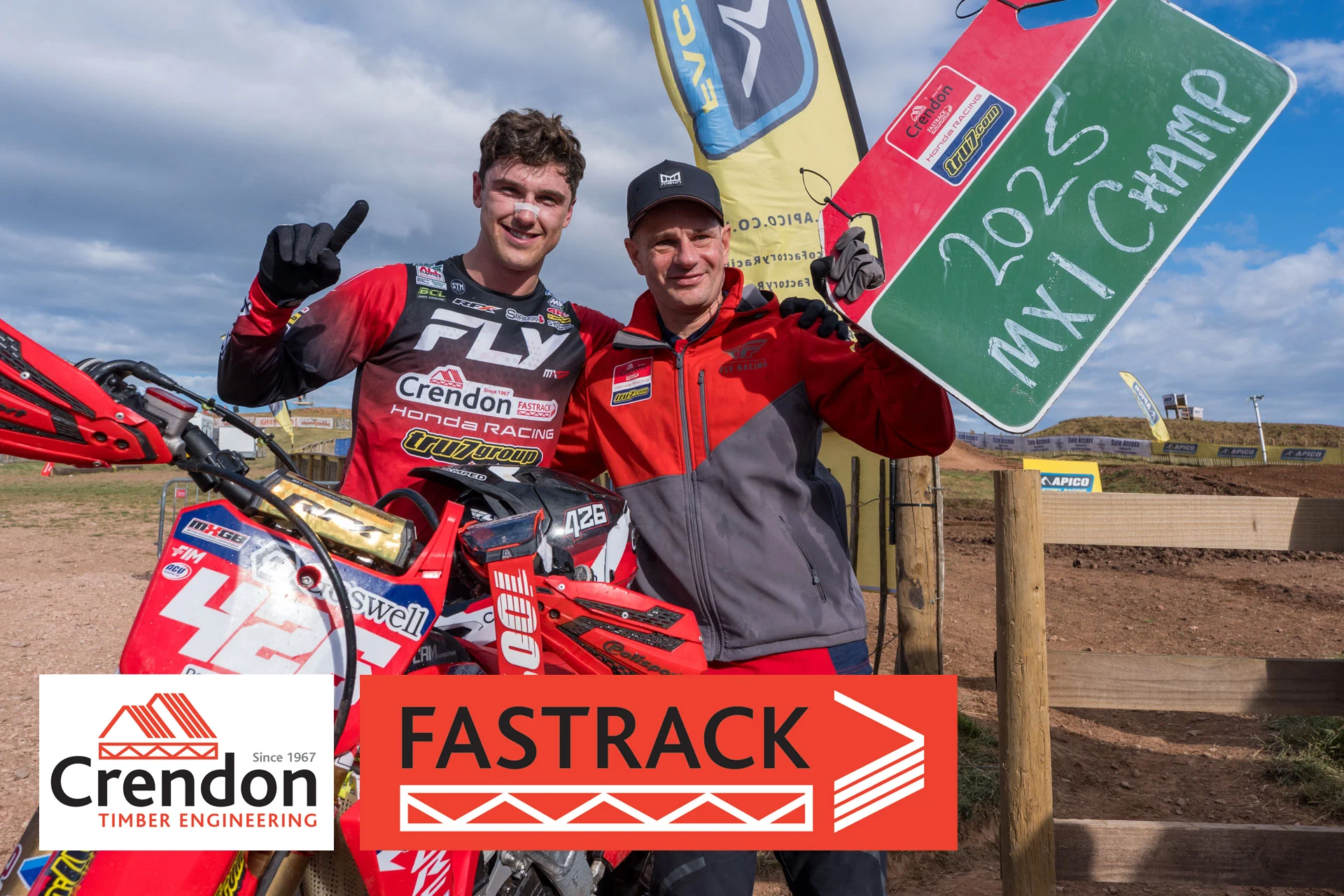 542750246_1348537560400501_7772971879225946772_n Two men posing for a winning photo stood next to an MX bike