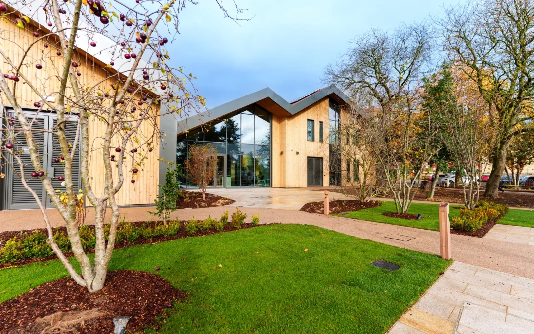 A timber building with top to floor windows