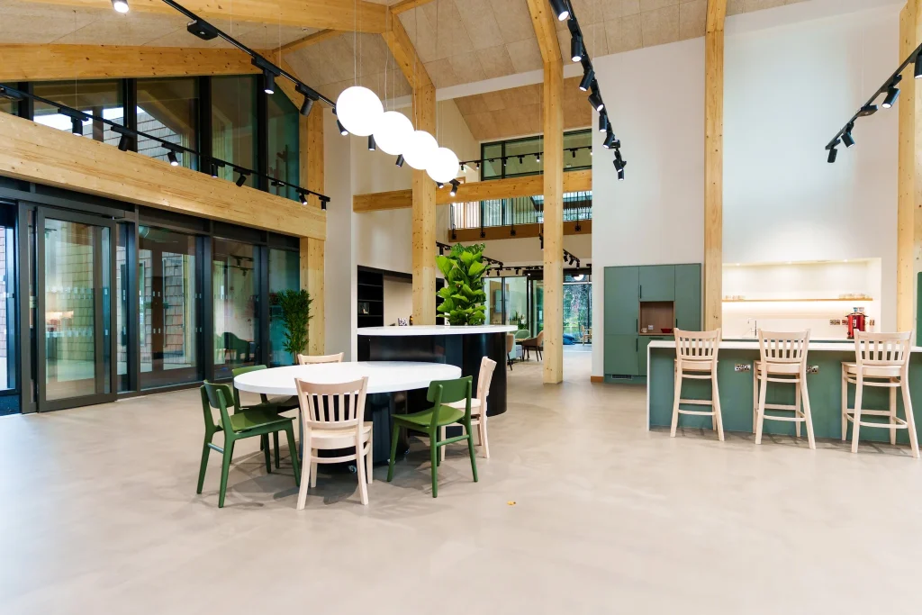 A timber arched structured room with a selection of modern furniture.