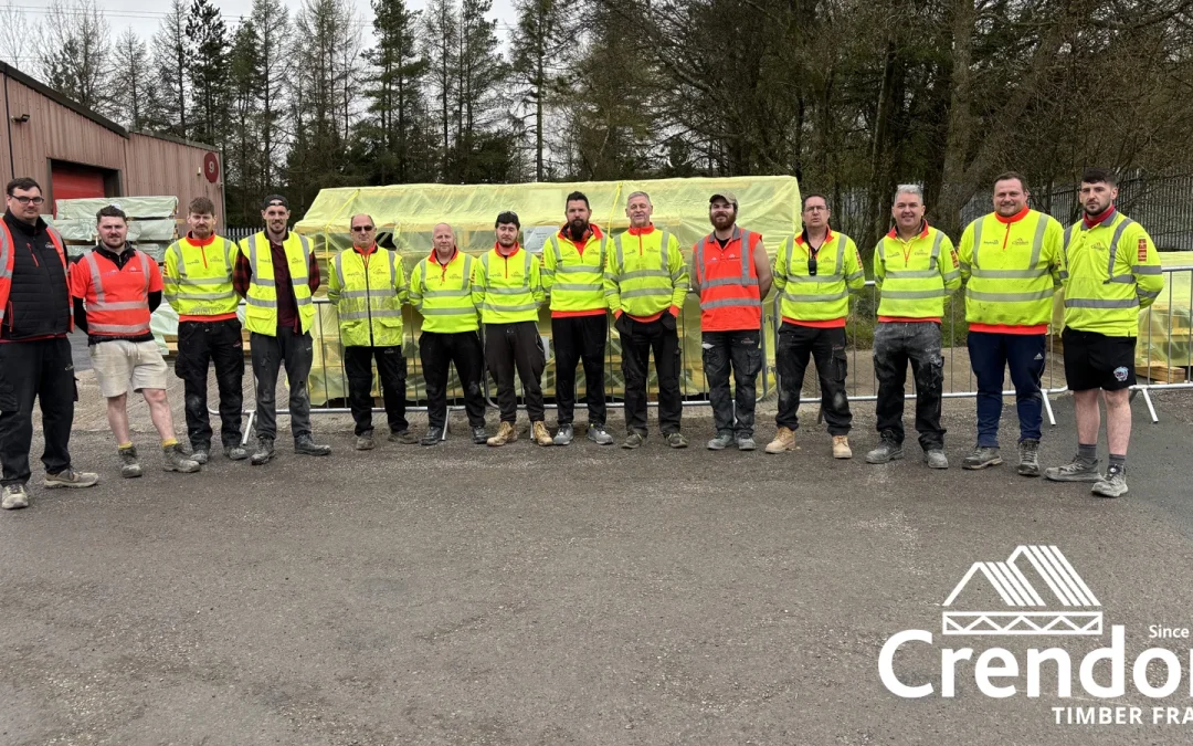 Team of men with most in yellow hi vis jackets and a couple in orange hi vis jackets