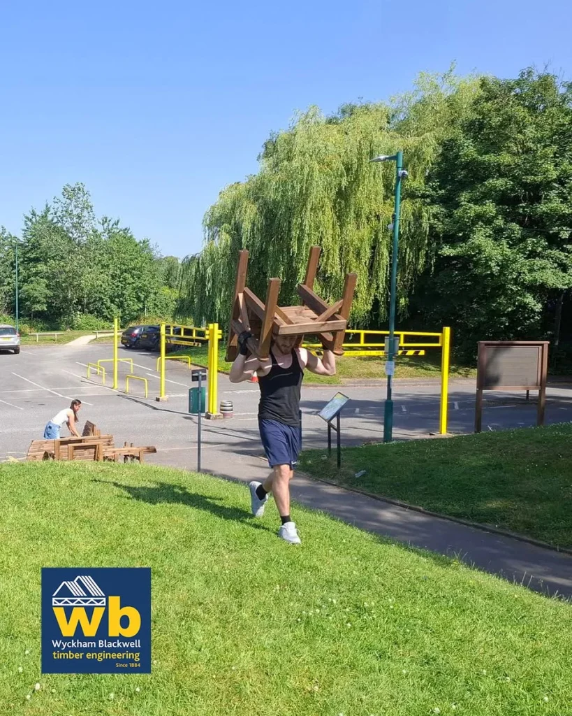 Man carrying a chair over his head