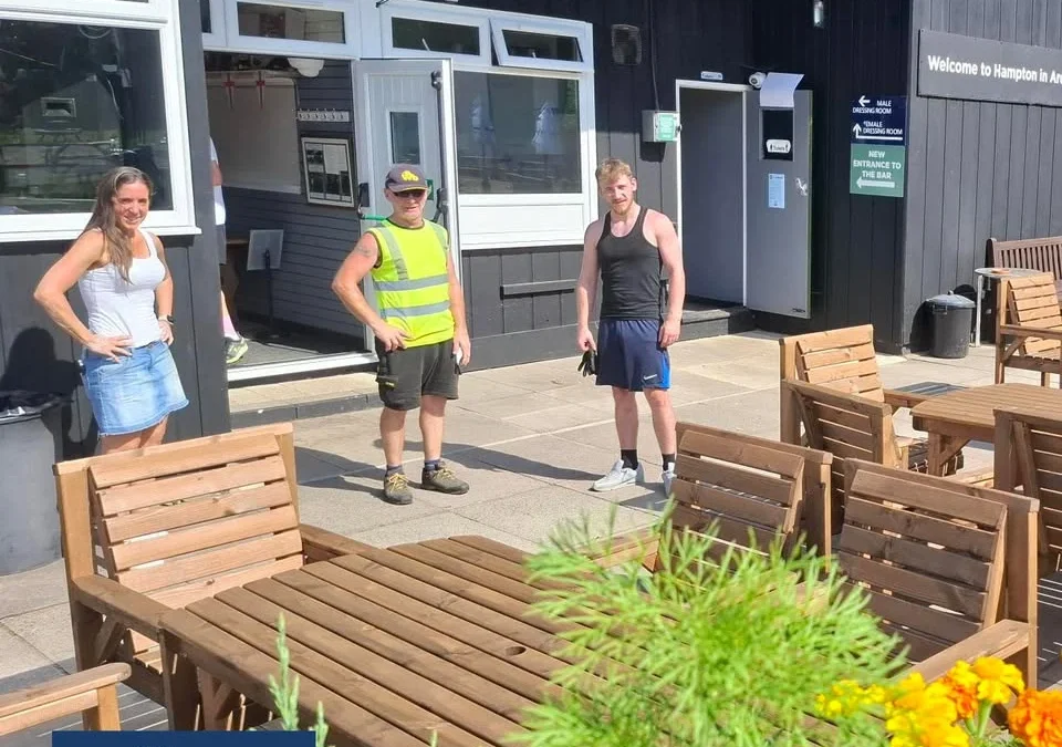 3 people stood outside a Sports Club