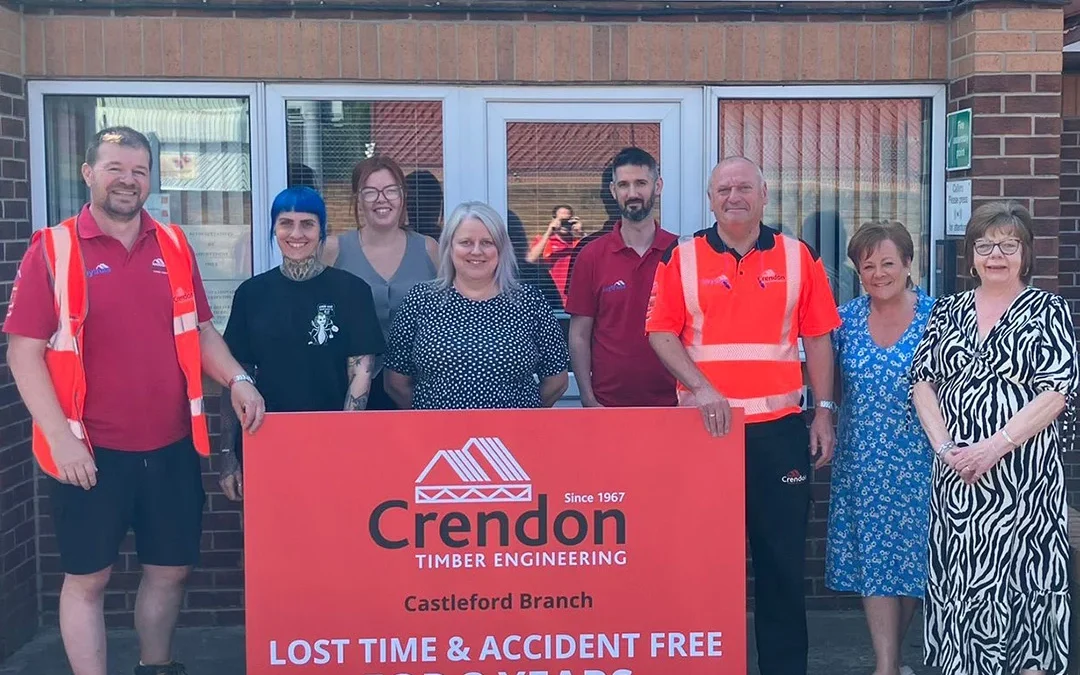 Team of people standing in front of Crendon Lost Time & Accident Free for 3 years